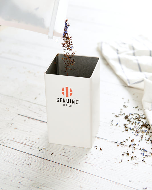 A sleek, airtight Genuine Tea Storage Canister, perfect for the kitchen counter, resembling those in coffee shops. Holds about 250g of tea, with dimensions 8.5cm by 15cm, ideal for bulk tea enthusiasts.